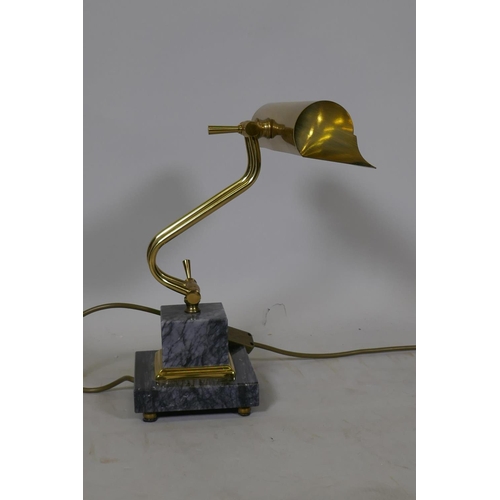 67 - A brass adjustable desk lamp, raised on a marble base, labelled Gibson Lighting, 23cm wide, 36cm hig... 