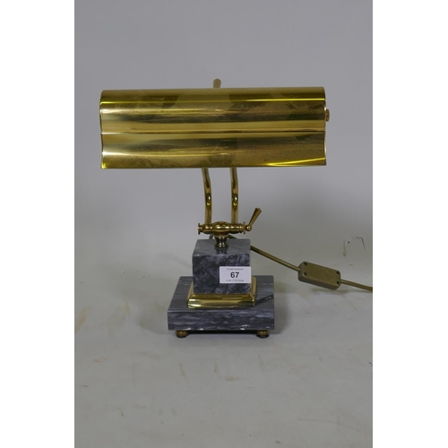 67 - A brass adjustable desk lamp, raised on a marble base, labelled Gibson Lighting, 23cm wide, 36cm hig... 