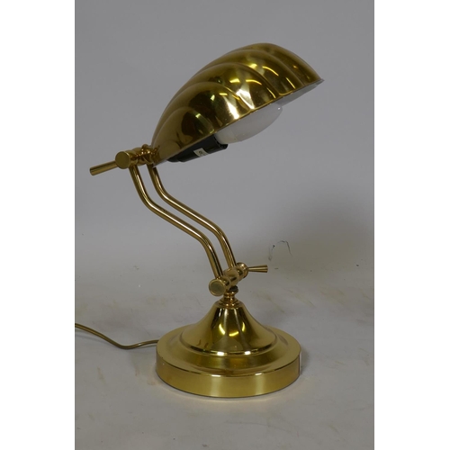 68 - An adjustable brass clam shell desk lamp, 18cm wide, 28cm high