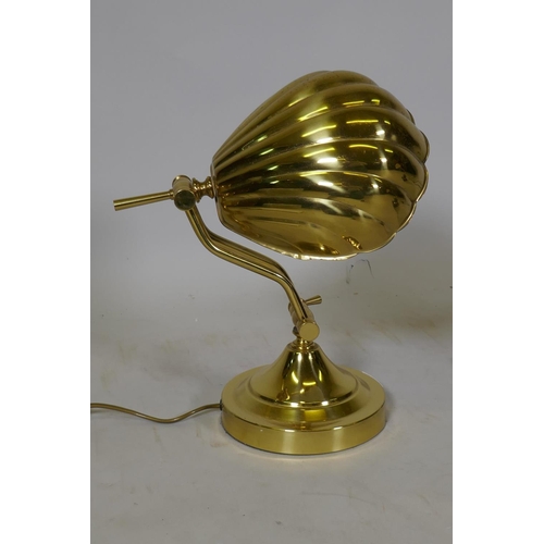 68 - An adjustable brass clam shell desk lamp, 18cm wide, 28cm high