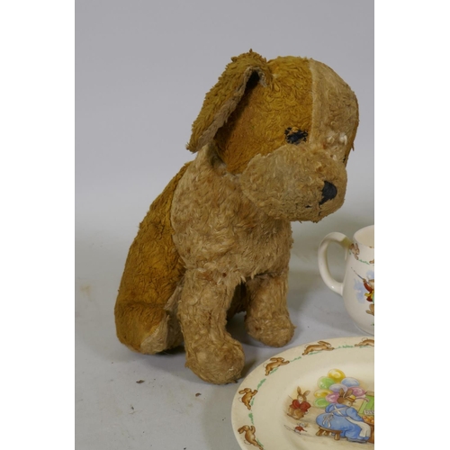 69 - A vintage stuffed plush toy dog with swivel head and a Merrythought dog, a Bunnykins mug and plate, ... 