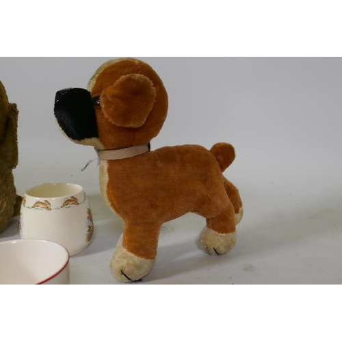 69 - A vintage stuffed plush toy dog with swivel head and a Merrythought dog, a Bunnykins mug and plate, ... 