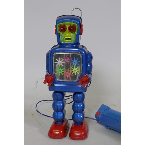 77 - A vintage Japanese battery operated tin plate robot, marked KO (Yoshiya), 23cm high