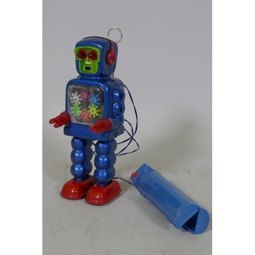 77 - A vintage Japanese battery operated tin plate robot, marked KO (Yoshiya), 23cm high