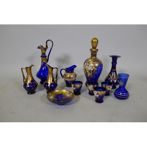 81 - Collection of Venetian blue glass, with gilt and enamel decoration, decanter, 25cm high