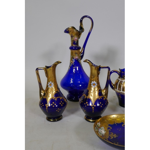 81 - Collection of Venetian blue glass, with gilt and enamel decoration, decanter, 25cm high