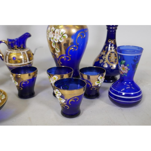 81 - Collection of Venetian blue glass, with gilt and enamel decoration, decanter, 25cm high