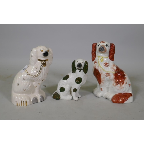 89 - Three Staffordshire pottery figures of dogs, one impressed Beswick No.1378-4, 26cm high