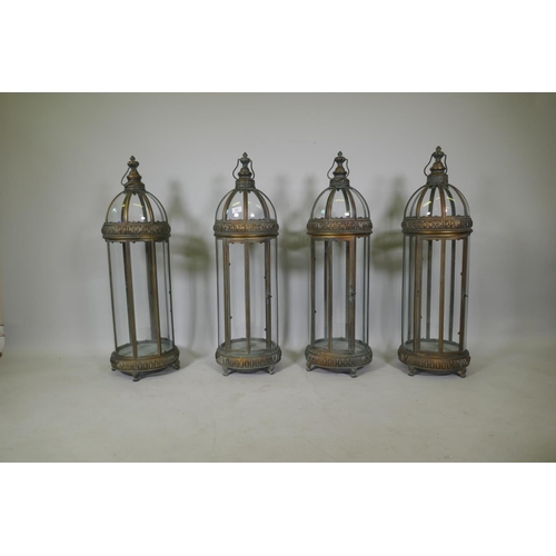 92 - Four gilt metal dome topped lanterns, 90cm high