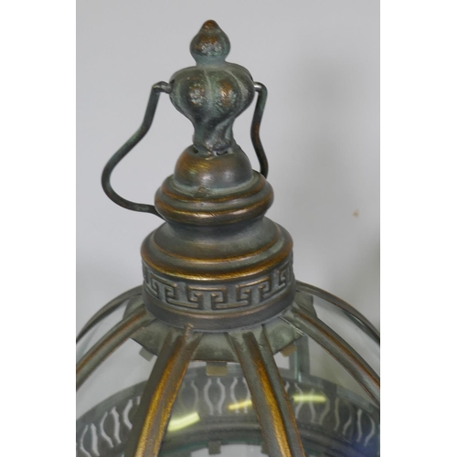 92 - Four gilt metal dome topped lanterns, 90cm high