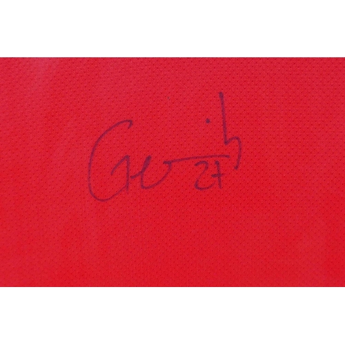 254 - An Arsenal 2011-12 Home Kit celebrating the club's 125th anniversary, signed by Gervinho, framed wit... 