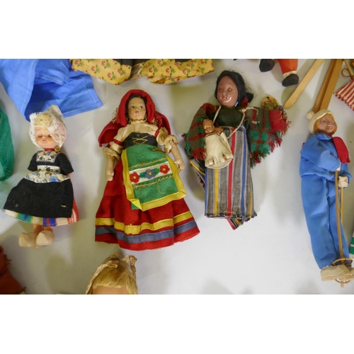 224 - A collection of antique dolls, Dutch, French, Scandinavian, including three Indian women in saris