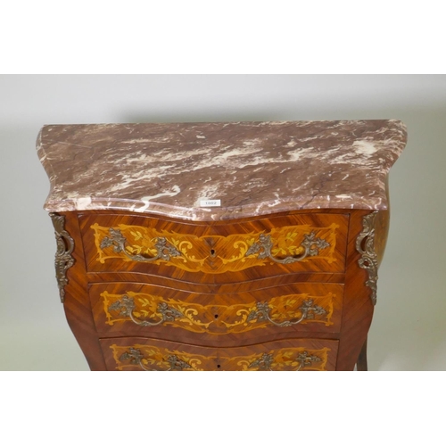 1002 - A Louis XV style marquetry inlaid serpentine front tulipwood commode with three drawers, rouge marbl... 