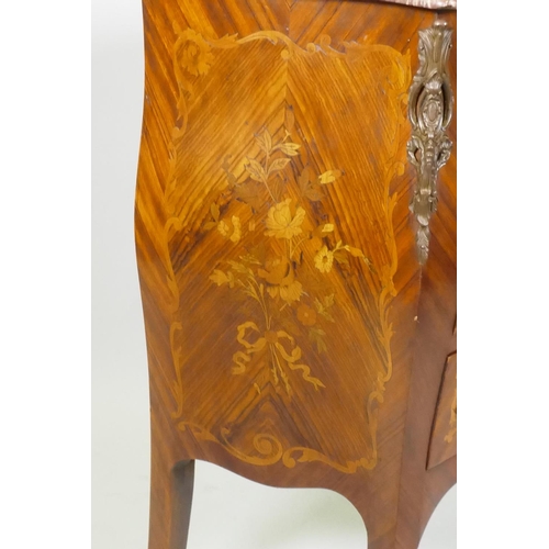 1002 - A Louis XV style marquetry inlaid serpentine front tulipwood commode with three drawers, rouge marbl... 