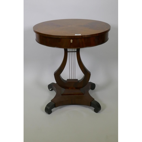 1003 - A C19th Scandinavian mahogany work table, the top with book matched figural veneers, pull out frieze... 