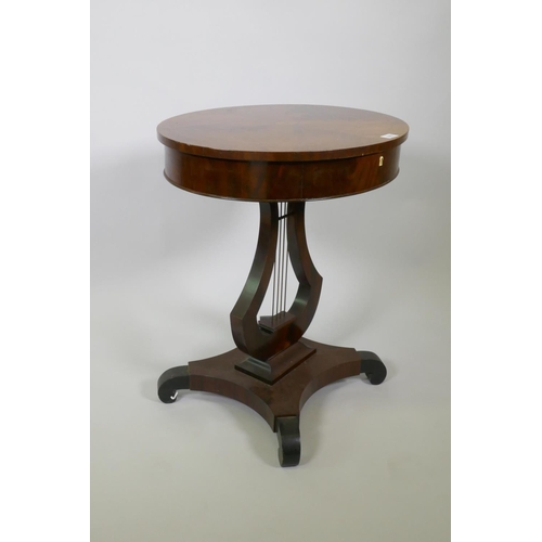 1003 - A C19th Scandinavian mahogany work table, the top with book matched figural veneers, pull out frieze... 