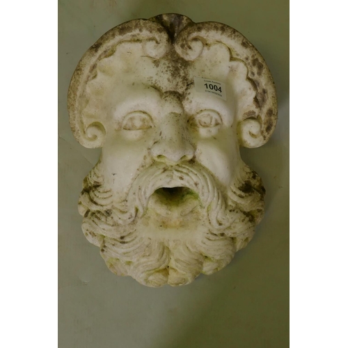 1004 - An antique marble fountain head in the form of a classical mask, 29cm high