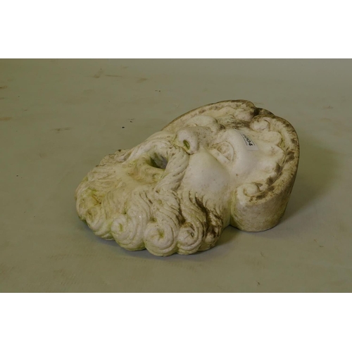 1004 - An antique marble fountain head in the form of a classical mask, 29cm high