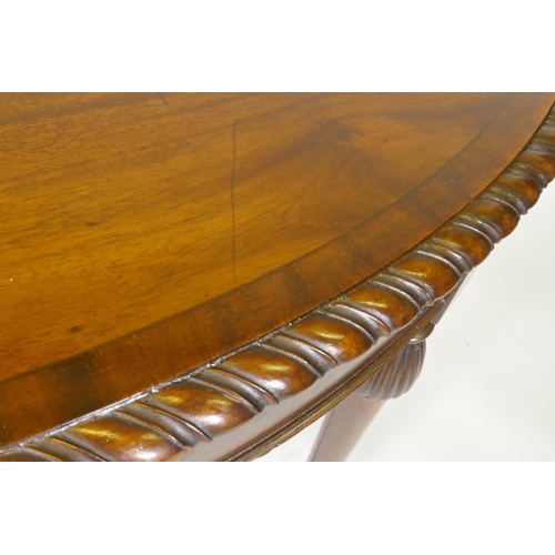 1007 - A C19th mahogany oval shaped occasional table in the manner of Gillows, with gadrooned edge and cros... 