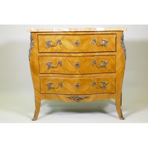 1008 - A Louis XV style tulipwood serpentine shaped three drawer commode with Sienna marble top and brass m... 