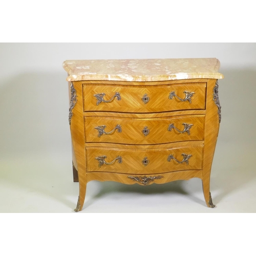 1008 - A Louis XV style tulipwood serpentine shaped three drawer commode with Sienna marble top and brass m... 