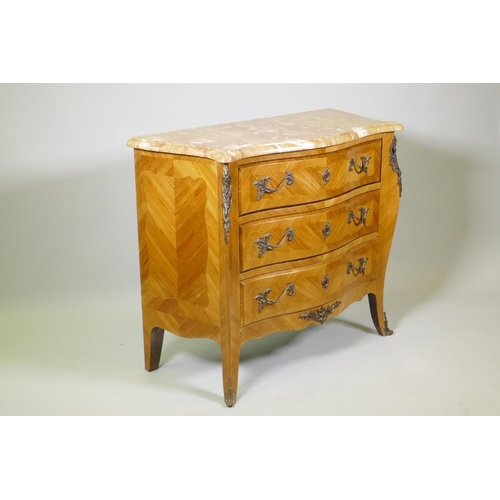 1008 - A Louis XV style tulipwood serpentine shaped three drawer commode with Sienna marble top and brass m... 