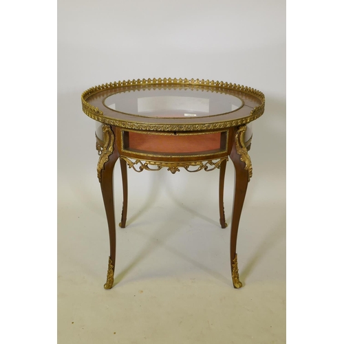 1012 - A Louis XV style kingwood and ormolu mounted bijouterie table, the lift up top with pierced gallery,... 