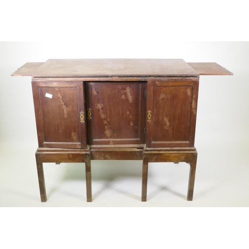 1017 - Georgian mahogany silver chest/canteen on stand, the inverted breakfront top over two cupboards fitt... 