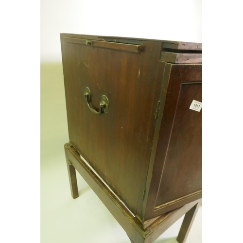 1017 - Georgian mahogany silver chest/canteen on stand, the inverted breakfront top over two cupboards fitt... 