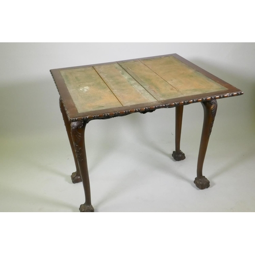 1018 - Chippendale style card table with fold over top and carved decoration, raised on cabriole supports w... 