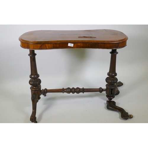 1020 - Victorian rosewood stretcher table, with shaped top and carved and turned columns, with cabriole sup... 