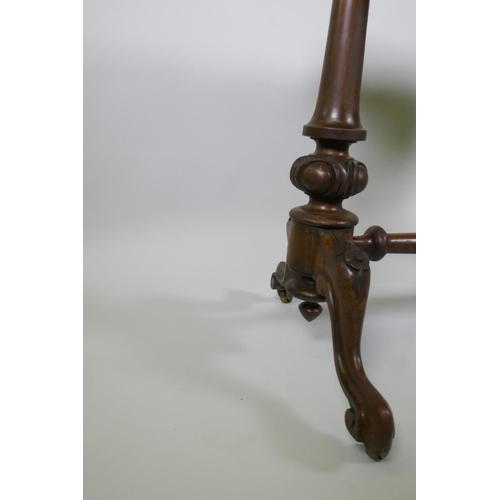 1020 - Victorian rosewood stretcher table, with shaped top and carved and turned columns, with cabriole sup... 