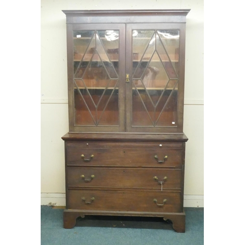 1025 - George III mahogany bookcase, the upper section with two glazed doors and adjustable shelves, the ba... 