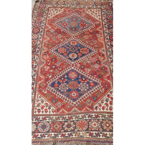 1032 - A Persian blue ground luri rug with geometric design and gold border, 154 x 108cm