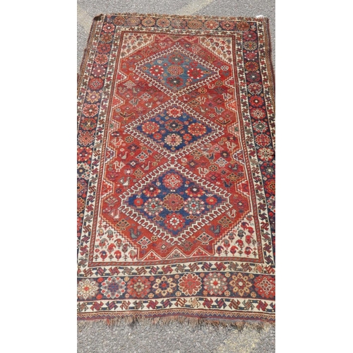 1032 - A Persian blue ground luri rug with geometric design and gold border, 154 x 108cm