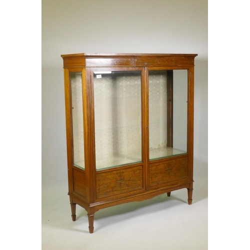 1034 - A good Victorian satinwood two door display cabinet with fine inlaid decoration and crossbanded top,... 