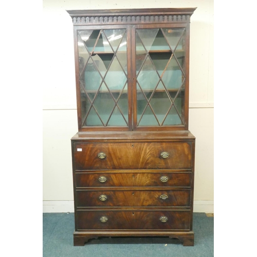 1035 - George III figured mahogany secretaire bookcase, the upper section with glazed doors and adjustable ... 