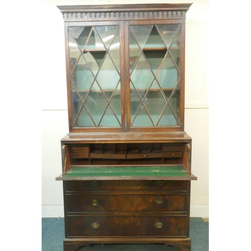 1035 - George III figured mahogany secretaire bookcase, the upper section with glazed doors and adjustable ... 