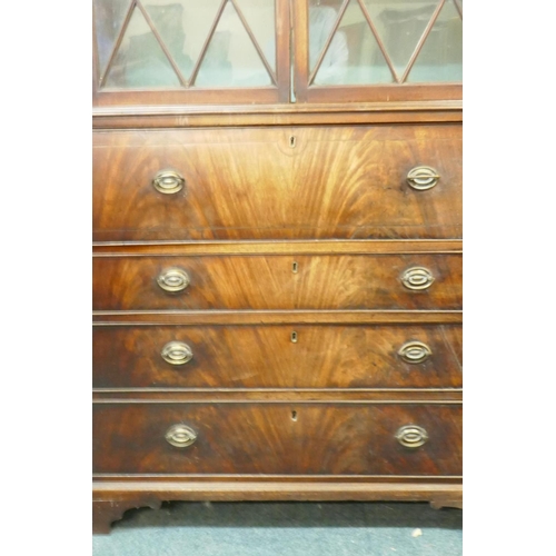 1035 - George III figured mahogany secretaire bookcase, the upper section with glazed doors and adjustable ... 