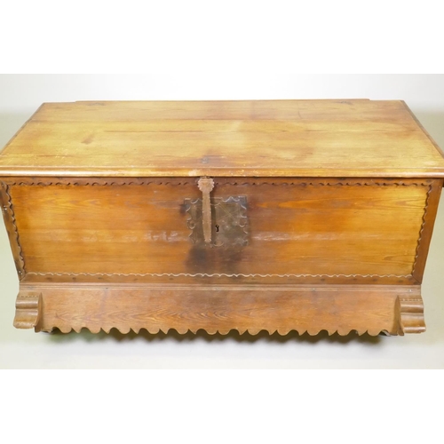 1038 - A C19th Continental pine dower chest with lift up top and decorative shaped apron, raised on turned ... 