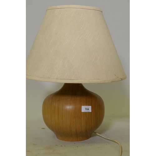 104 - A contemporary plywood table lamp, 50cm high with shade