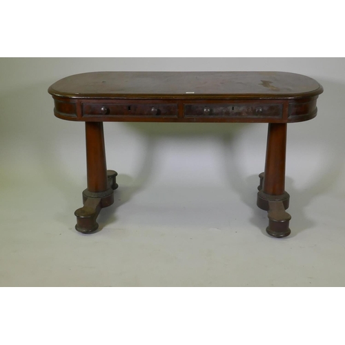 1053 - An early C19th mahogany oval top centre/library table, with two true and two false drawers, raised o... 