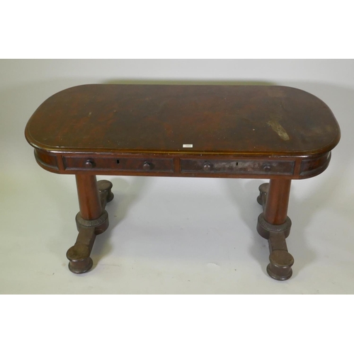 1053 - An early C19th mahogany oval top centre/library table, with two true and two false drawers, raised o... 