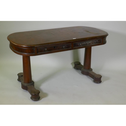 1053 - An early C19th mahogany oval top centre/library table, with two true and two false drawers, raised o... 