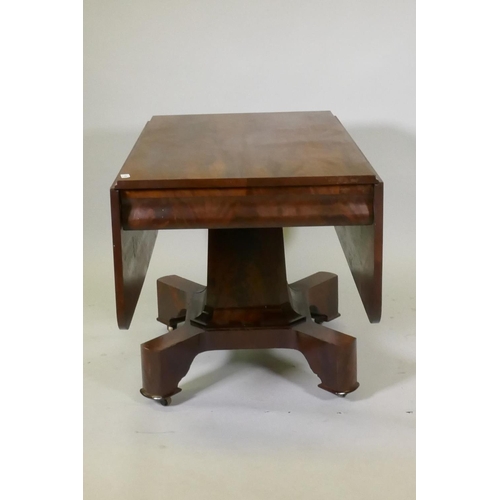 1055 - C19th figured mahogany drop leaf centre table, with moulded frieze, raised on a shaped column and pl... 