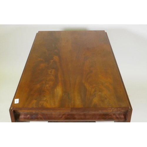 1055 - C19th figured mahogany drop leaf centre table, with moulded frieze, raised on a shaped column and pl... 