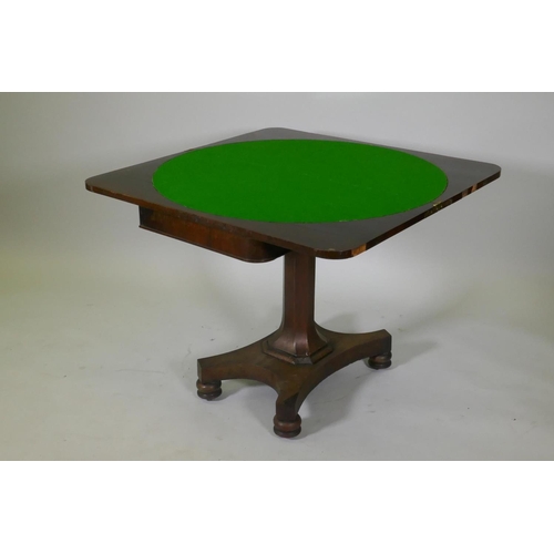 1058 - Early C19th rosewood card table, with fold out top and baized interior, raised on a tapering hexagon... 