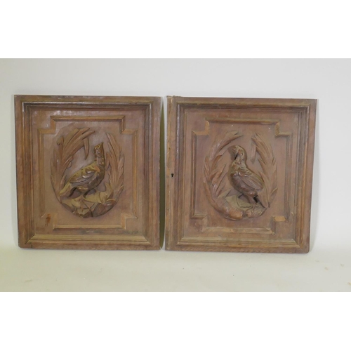 1059 - A pair of C19th Flemish oak panels with carved decoration of game birds, 60 x 64cm