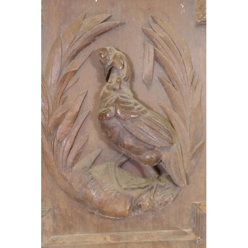 1059 - A pair of C19th Flemish oak panels with carved decoration of game birds, 60 x 64cm