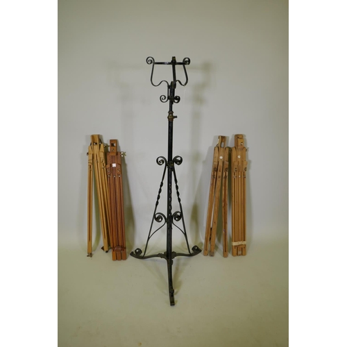 1061 - Three Winsor and Newton field easels, a similar Daler Rowney easel, and a painted metal torchere, 13... 